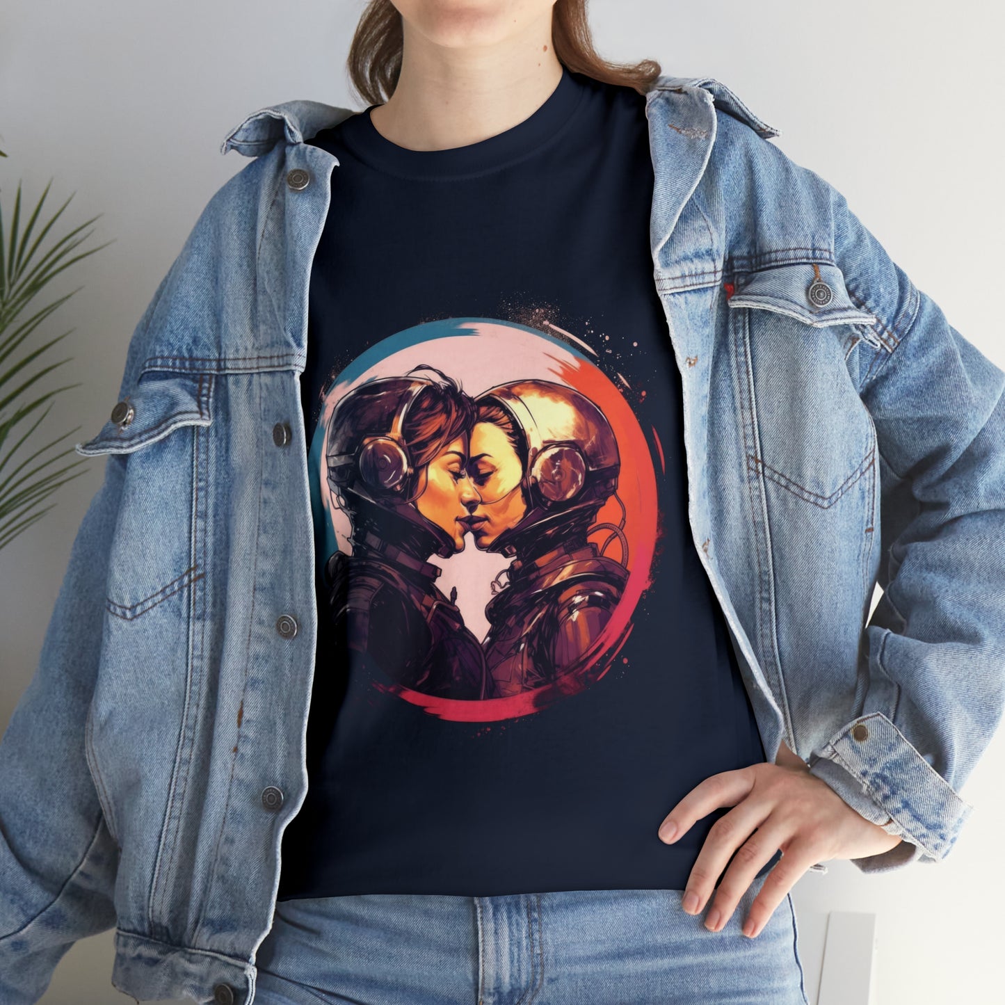 Mockup of a woman wearing a medium fabric denim jacket and navy-blue t-shirt; the t-shirt displays two futuristic, sapphic astronauts kissing outlined in red-and-blue bordered circle.
