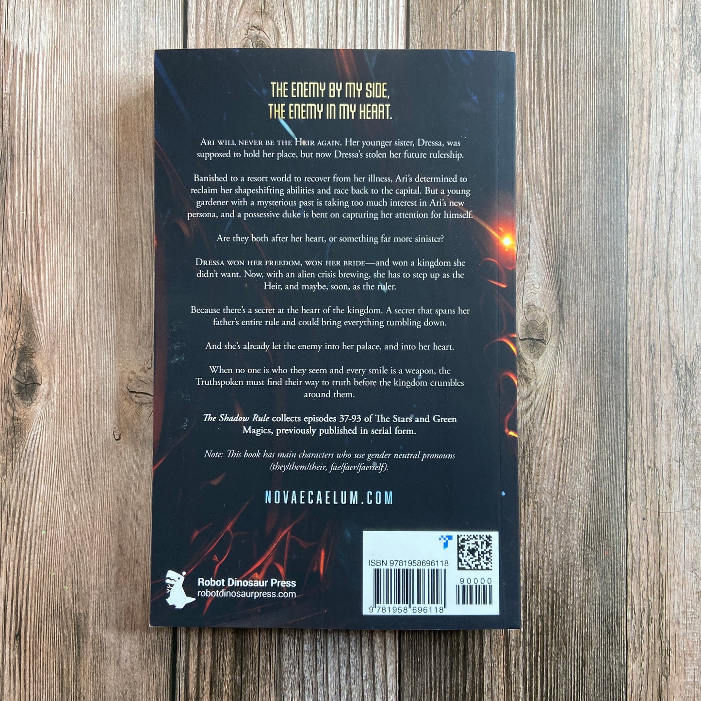 Back of paperback titled "The Shadow Rule: The Stars and Green Magics - Book 2" by Novae Caelum, with the tagline of: "The enemy by my side, the enemy in my heart."