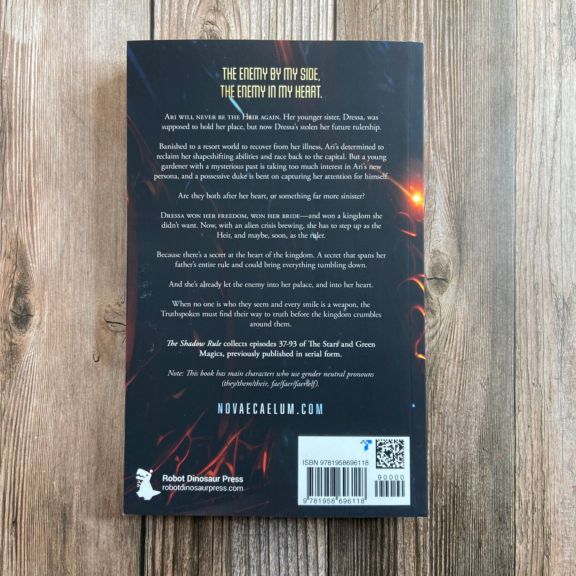 Back of paperback titled "The Shadow Rule: The Stars and Green Magics - Book 2" by Novae Caelum, with the tagline of: "The enemy by my side, the enemy in my heart."