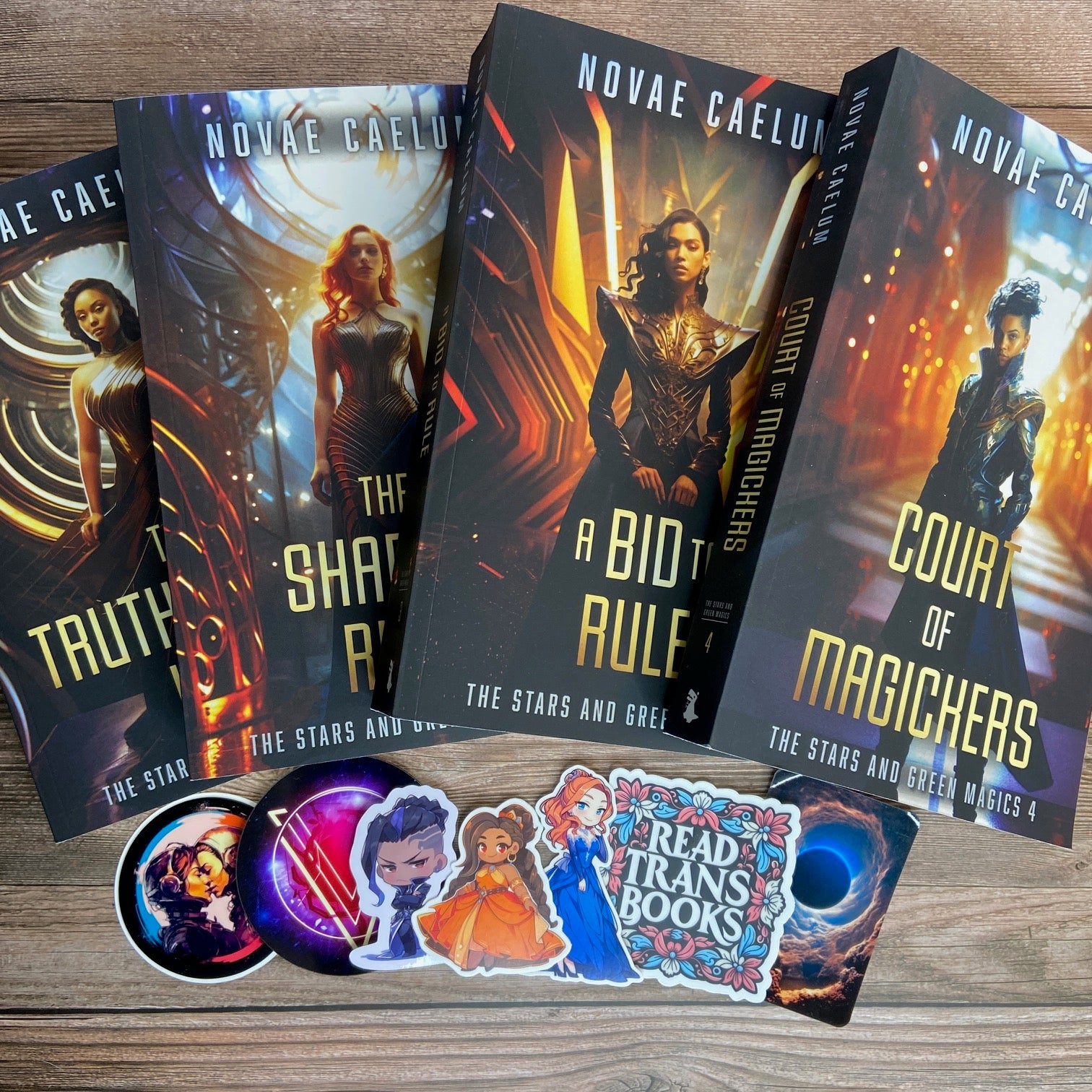 Bundle of 4 paperbacks (Books 1-4) from "The Stars and Green Magics" series by Novae Caelum; there are also 7 series-related swag pieces arranged below the books.