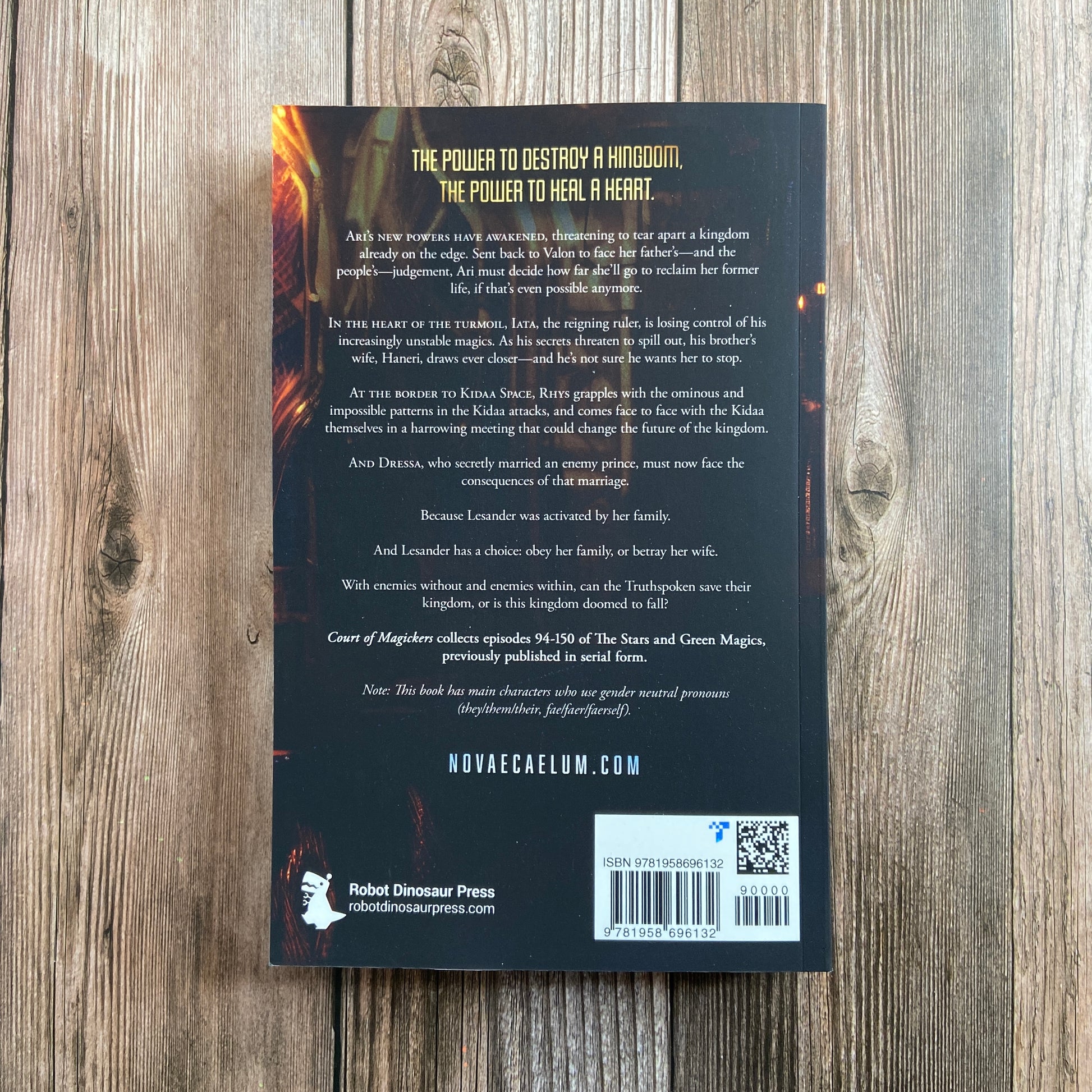 The back of a Novae Caelum SIGNED Court of Magickers: The Stars and Green Magics Book 4 (Paperback) with an image of a magic fire.
