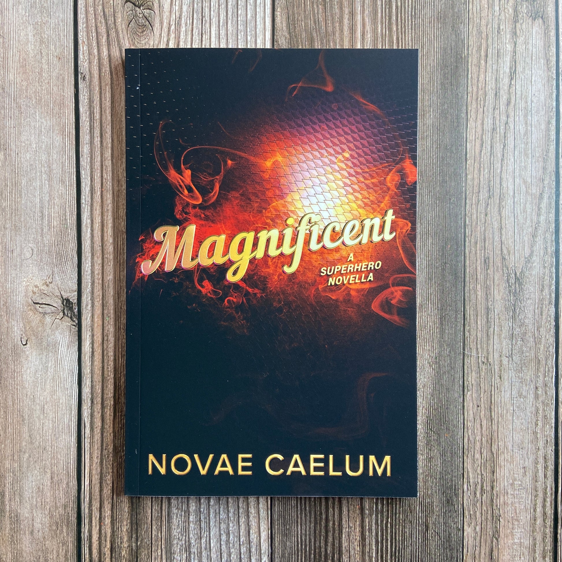 Novae Caelum SIGNED Magnificent: A Nonbinary Superhero Novella (Paperback) featuring a superpowered family and a genderqueer hero saving the world.