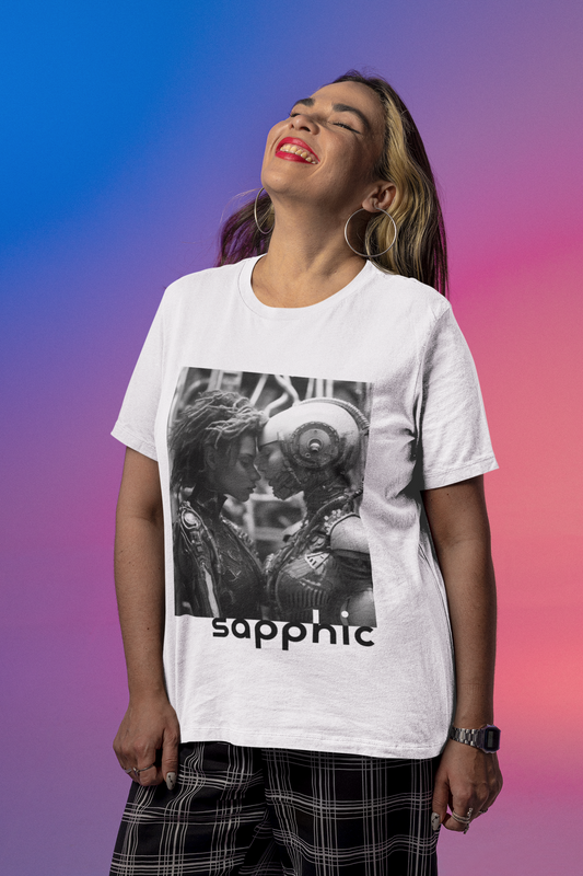 Mockup of a woman in a white t-shirt posing against a gradient color background; the t-shirt displays a black and white image of two sapphic cyborgs with foreheads together and eyes closed in a romantic scene.