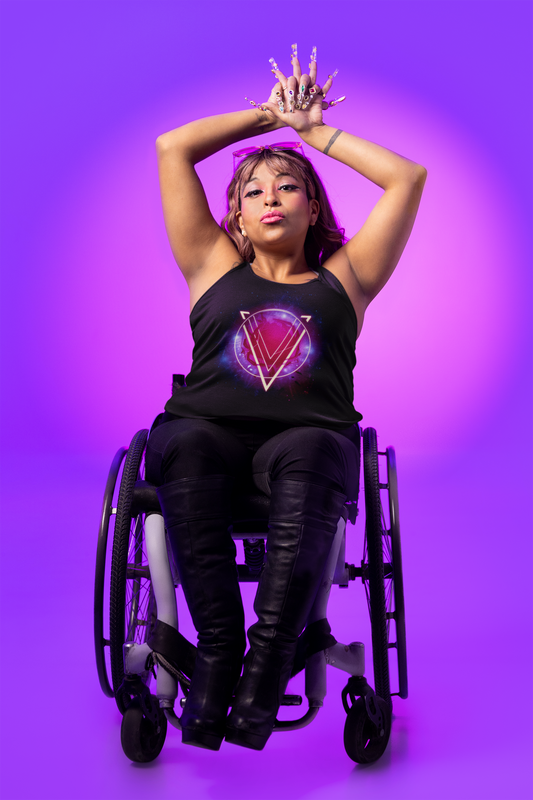Mockup of a woman in a wheelchair wearing a black tank top shirt while in front of a color gradient background; the shirt image displays a pink and purple circle with a large V superimposed over it. The image is titled "The Rings of Vietor Band Logo".